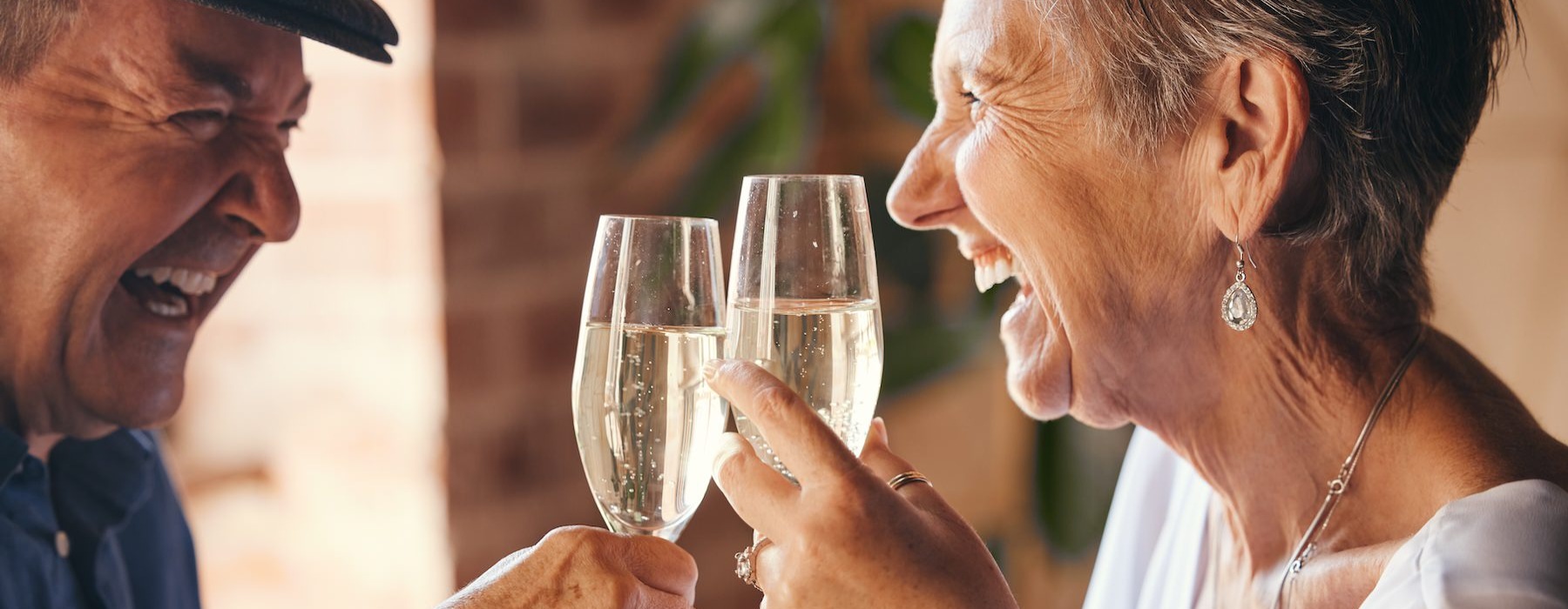 a couple of people holding wine glasses