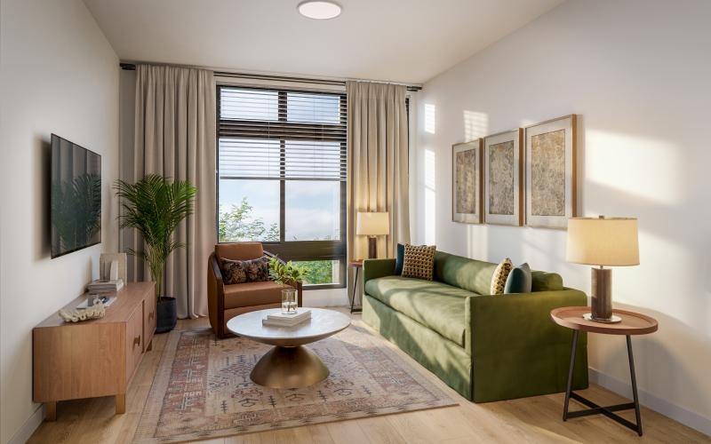 a living room with a green couch